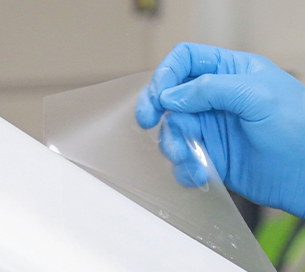 A topcoat film is applied to a car A topcoat film is applied to a car