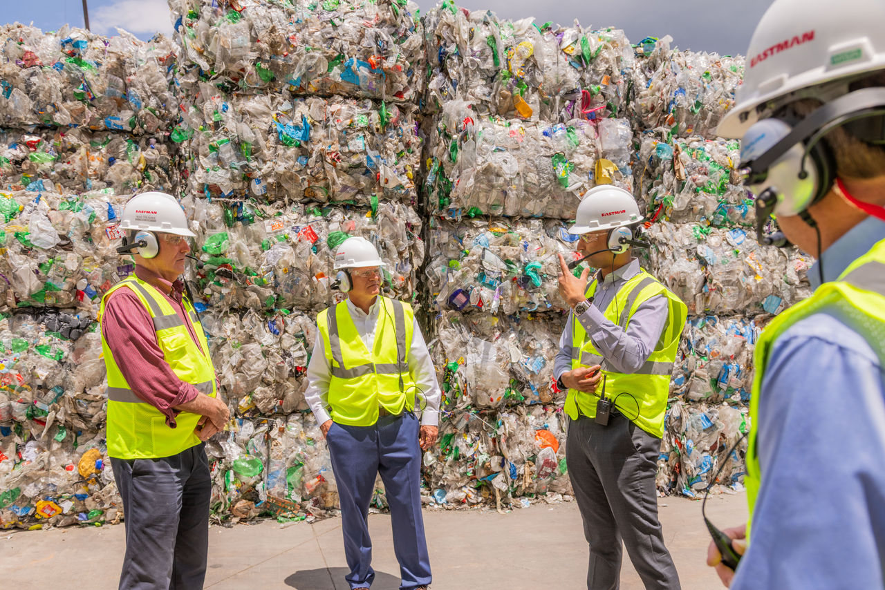 Eastman team members show the EPA representatives bales of recycled plastic waste. Eastman team members show the EPA representatives bales of recycled plastic waste.